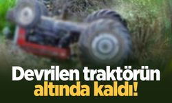 Devrilen traktörün altında kaldı!