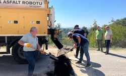 Doğalgaz hattı tamamlanan bölgelerde asfalt yama çalışmaları hız kazandı