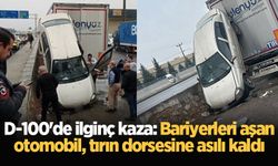 D-100'de ilginç kaza: Bariyerleri aşan otomobil, tırın dorsesine asılı kaldı