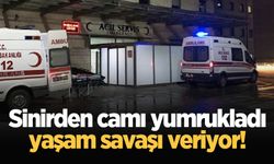 Sinirden camı yumrukladı, yaşam savaşı veriyor!