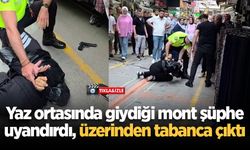 Yaz ortasında giydiği mont şüphe uyandırdı, üzerinden tabanca çıktı