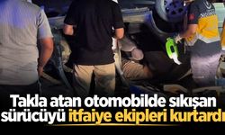 Takla atan otomobilde sıkışan sürücüyü itfaiye ekipleri kurtardı