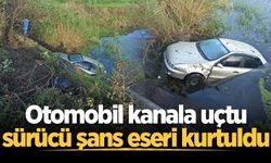 Otomobil kanala uçtu, sürücü şans eseri kurtuldu