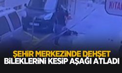 Şehir merkezinde dehşet anları; Bileklerini kesip aşağı atladı