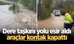 Dere taşkını yolu esir aldı, araçlar kontak kapattı