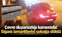Çevre duyarsızlığı kamerada! Sigara izmaritlerini sokağa döktü