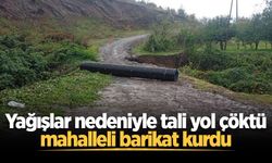 Yağışlar nedeniyle tali yol çöktü, mahalleli barikat kurdu