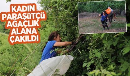 Serdivan'da kadın paraşütçü ağaçlık alana çakıldı
