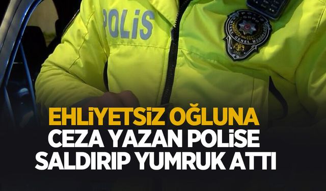 Ehliyetsiz oğluna ceza yazdı diye polise yumruk attı