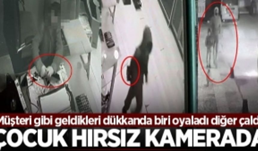 Müşteri gibi geldikleri dükkanda biri oyaladı diğer çaldı