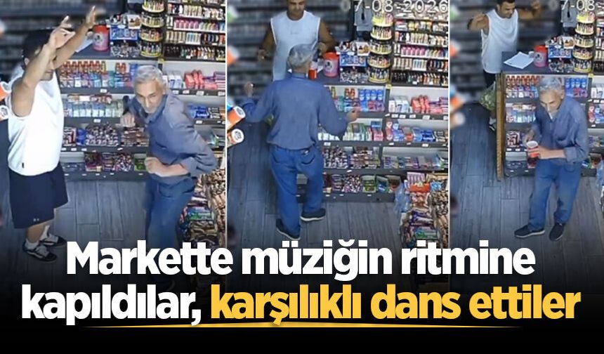 Markette kendini müziğin ritmine kaptıran müşteri ve esnaf kamerada